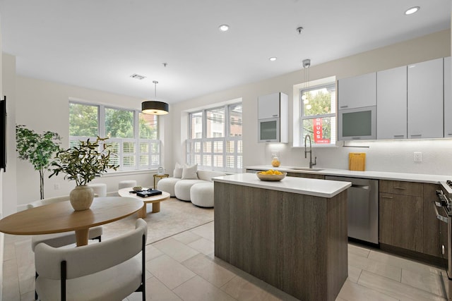 471 Monmouth St Unit 1, Jersey City, NJ 07302 - kitchen with dishwasher, a sink, a kitchen island, plenty of natural light, and recessed lighting