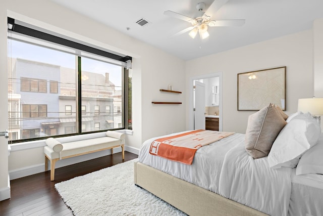 471 Monmouth St Unit 1, Jersey City, NJ 07302 - bedroom with wood finished floors, baseboards, connected bathroom, and ceiling fan