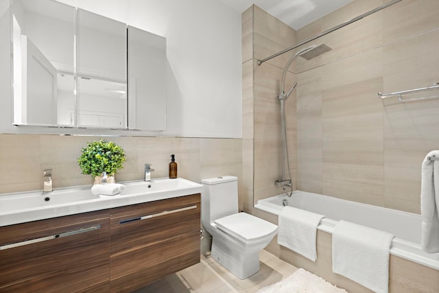 471 Monmouth St Unit 1, Jersey City, NJ 07302 - full bath featuring tiled shower / bath, vanity, tile walls, toilet, and decorative backsplash