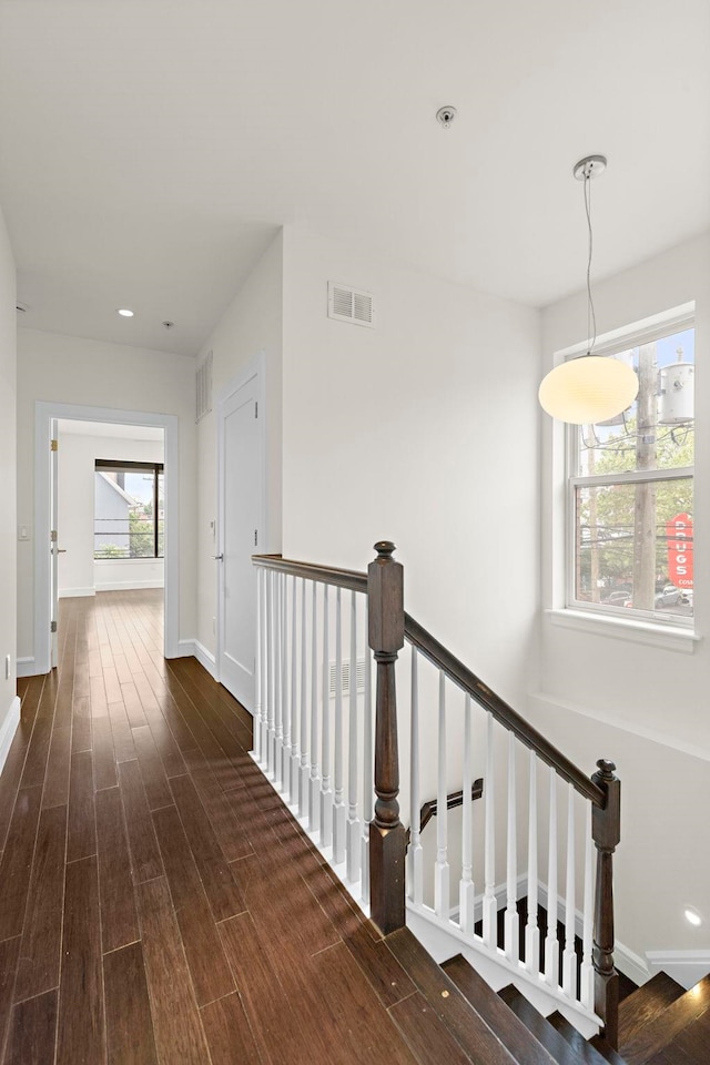 471 Monmouth St Unit 1, Jersey City, NJ 07302 - corridor featuring dark wood finished floors, baseboards, recessed lighting, and an upstairs landing