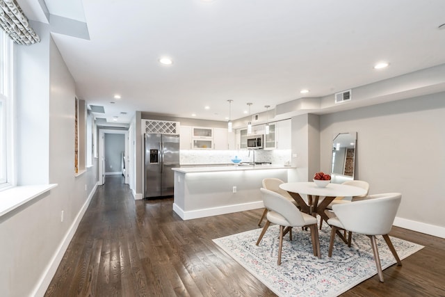 126 Delaware Ave Unit 10, Jersey City, NJ 07306 - dining area featuring dark wood-type flooring, baseboards, and recessed lighting
