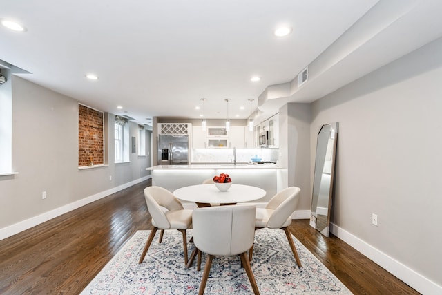126 Delaware Ave Unit 10, Jersey City, NJ 07306 - dining area with baseboards, recessed lighting, and dark wood-type flooring