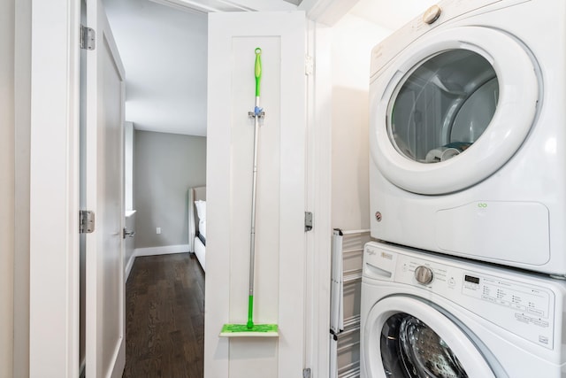 126 Delaware Ave Unit 10, Jersey City, NJ 07306 - laundry area with estacked washer and dryer, wood finished floors, and baseboards