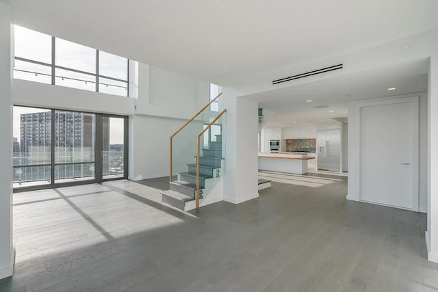 320 Adolphus Ave Unit 316, Cliffside Park, NJ 07010 - unfurnished living room with wood finished floors, stairs, baseboards, and recessed lighting