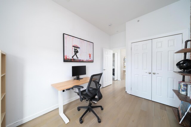 office area with wood finished floors and baseboards