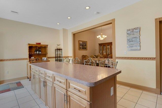 91 Sherman Pl, Jersey City, NJ 07307 - kitchen featuring light tile patterned floors, a kitchen island, a chandelier, recessed lighting, and pendant lighting