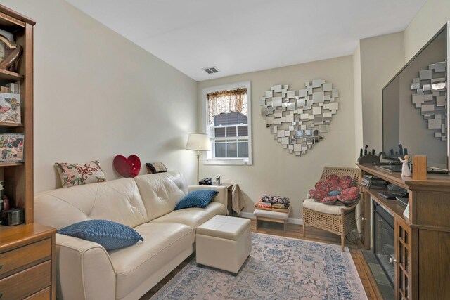 91 Sherman Pl, Jersey City, NJ 07307 - living area featuring wood finished floors and baseboards