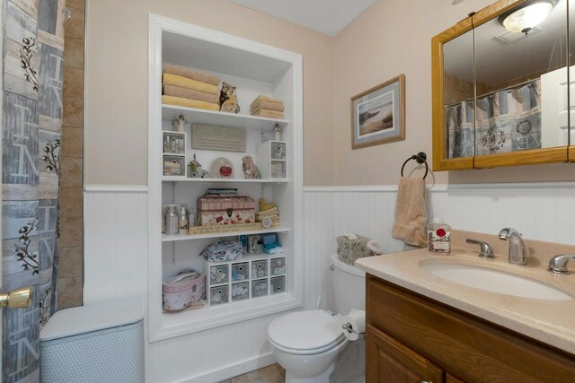 91 Sherman Pl, Jersey City, NJ 07307 - bathroom featuring a wainscoted wall, vanity, toilet, and a shower with shower curtain