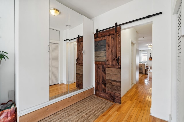 60 Monroe St Unit 8, Hoboken, NJ 07030 - hall featuring a barn door and light wood finished floors