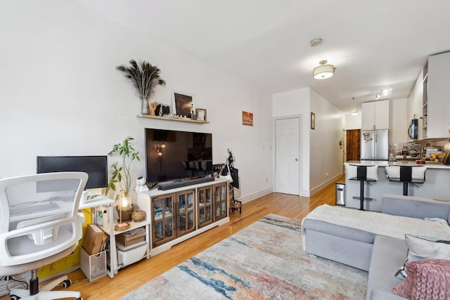 60 Monroe St Unit 8, Hoboken, NJ 07030 - living room with light wood-style floors and baseboards