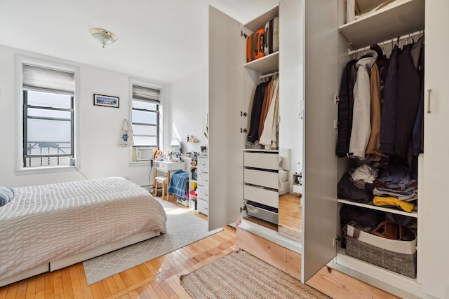 60 Monroe St Unit 8, Hoboken, NJ 07030 - bedroom with hardwood / wood-style flooring, cooling unit, and a closet