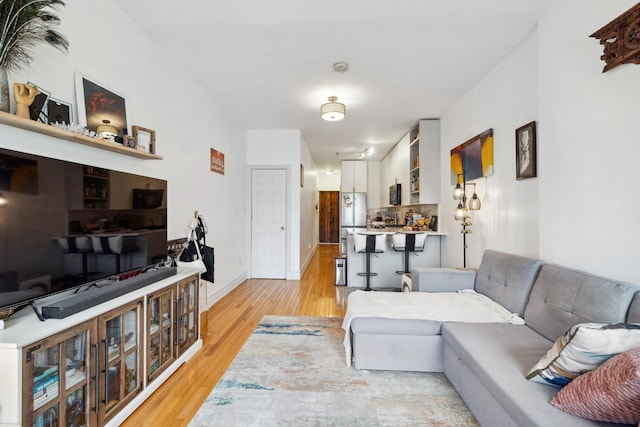 60 Monroe St Unit 8, Hoboken, NJ 07030 - living area featuring light wood-style floors and baseboards