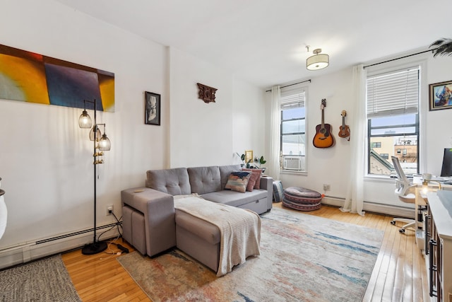 60 Monroe St Unit 8, Hoboken, NJ 07030 - living room with a baseboard radiator, light wood finished floors, cooling unit, and baseboard heating