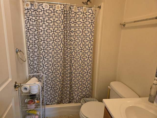 bathroom featuring vanity, a shower with shower curtain, and toilet