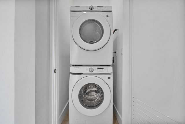371 New York Ave Unit 2, Jersey City, NJ 07307 - laundry room with estacked washer and dryer and baseboards