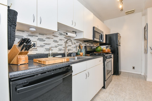 29 51st St Unit B5, Weehawken, NJ 07086 - kitchen with black appliances, backsplash, dark countertops, and white cabinetry