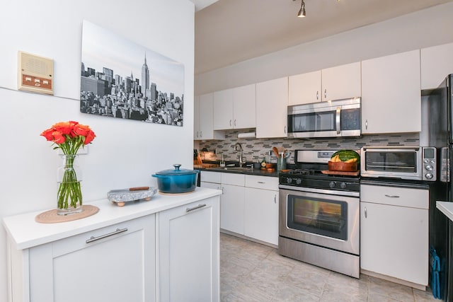 29 51st St Unit B5, Weehawken, NJ 07086 - kitchen with stainless steel appliances and tasteful backsplash