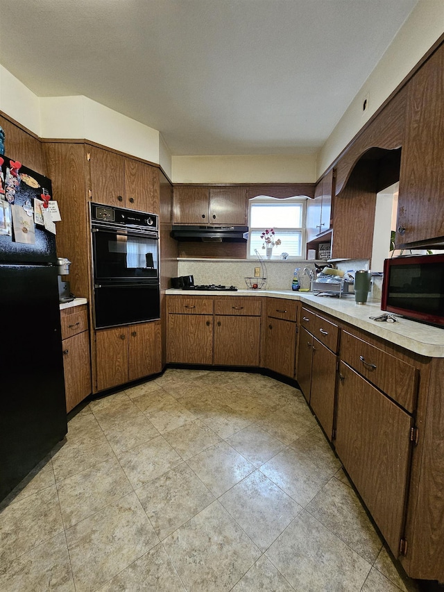 kitchen featuring backsplash and black appliances