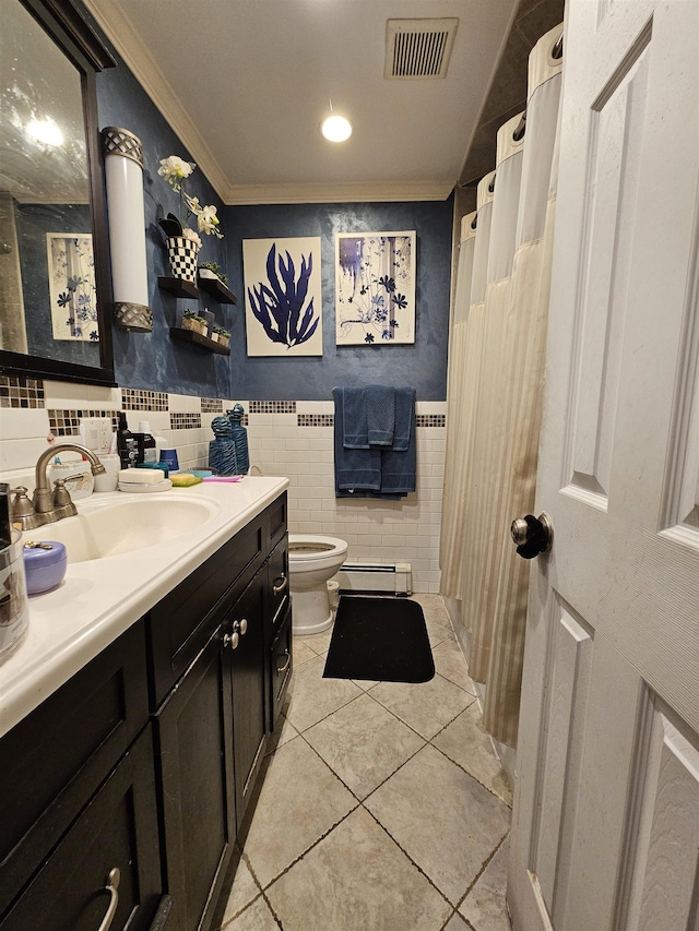 bathroom with ornamental molding, vanity, a baseboard heating unit, tile walls, and tile patterned flooring