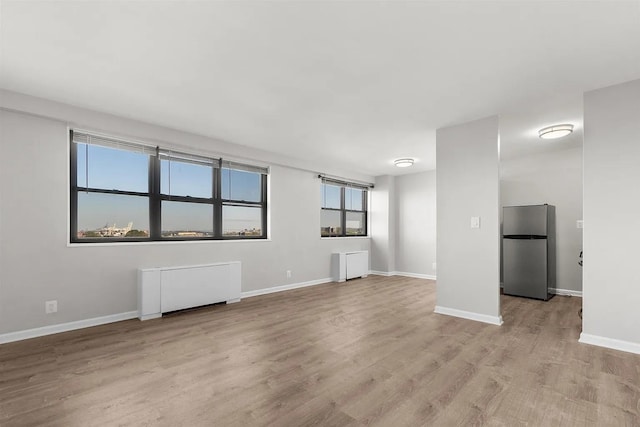 1225 Kennedy Blvd Unit 9H, Bayonne, NJ 07002 - spare room featuring light wood-style floors and baseboards