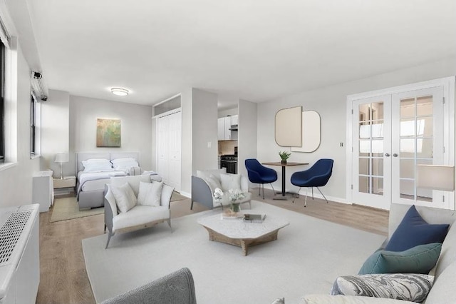 1225 Kennedy Blvd Unit 9H, Bayonne, NJ 07002 - living room featuring wood finished floors and french doors