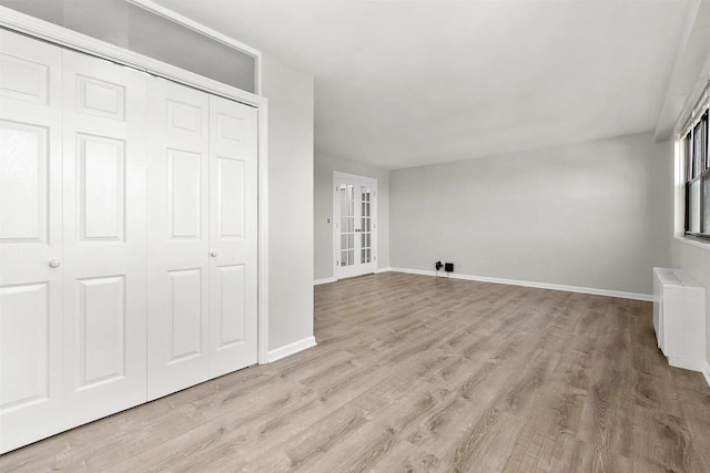 1225 Kennedy Blvd Unit 9H, Bayonne, NJ 07002 - unfurnished bedroom featuring light wood-style floors and a closet