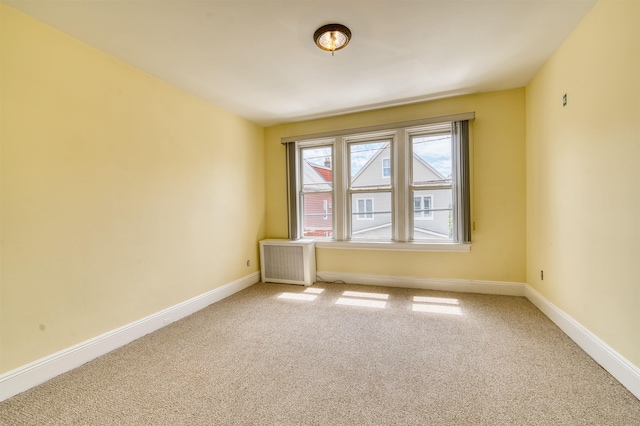 159 W 33rd St, Bayonne, NJ 07002 - unfurnished room with light colored carpet and baseboards