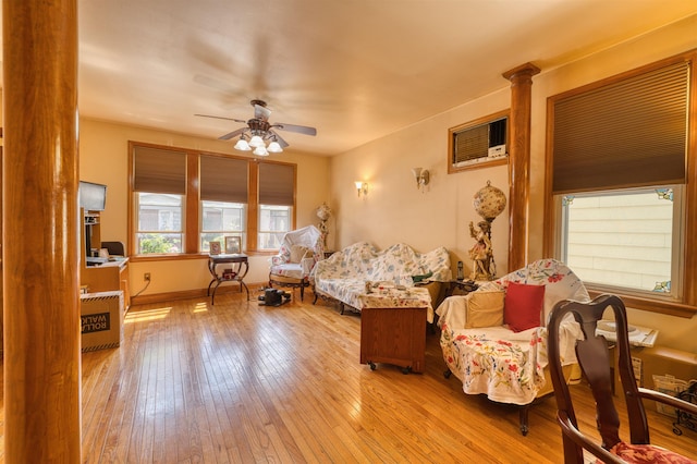 159 W 33rd St, Bayonne, NJ 07002 - living room with a ceiling fan, hardwood / wood-style floors, decorative columns, and baseboards