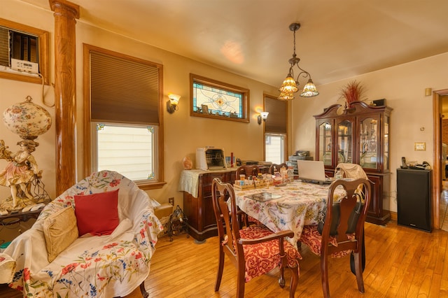 159 W 33rd St, Bayonne, NJ 07002 - dining space featuring light wood finished floors and a chandelier