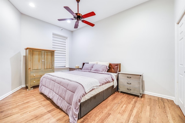 bedroom with recessed lighting, light wood-type flooring, and baseboards