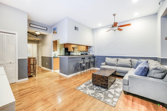 living area featuring light wood-type flooring, visible vents, a ceiling fan, and recessed lighting