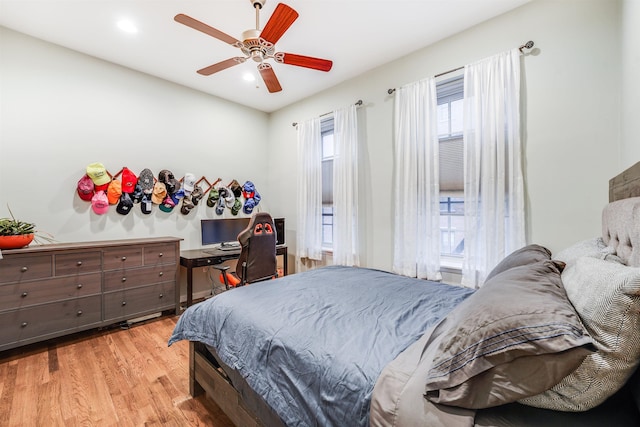 bedroom featuring ceiling fan and wood finished floors