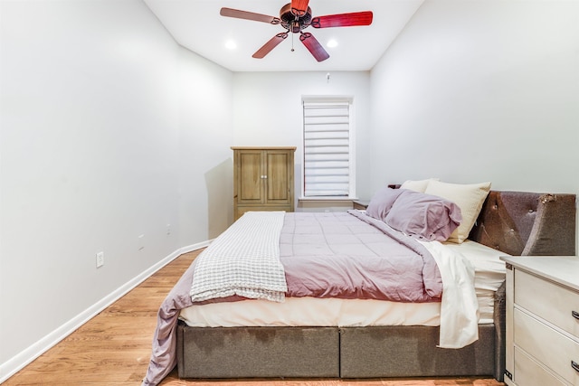 bedroom with light wood finished floors, recessed lighting, a ceiling fan, and baseboards