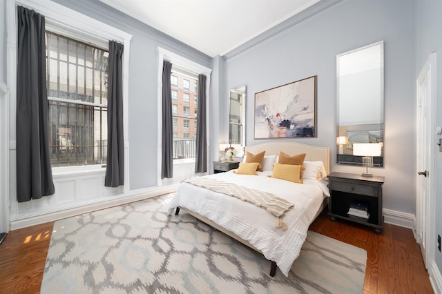 83 Montgomery St Unit 201, Jersey City, NJ 07302 - bedroom featuring wood finished floors and baseboards