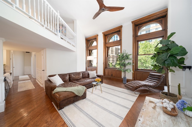 83 Montgomery St Unit 201, Jersey City, NJ 07302 - living area featuring wood finished floors, ceiling fan, and a decorative wall