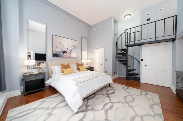 83 Montgomery St Unit 201, Jersey City, NJ 07302 - bedroom with wood finished floors, a towering ceiling, and ornamental molding
