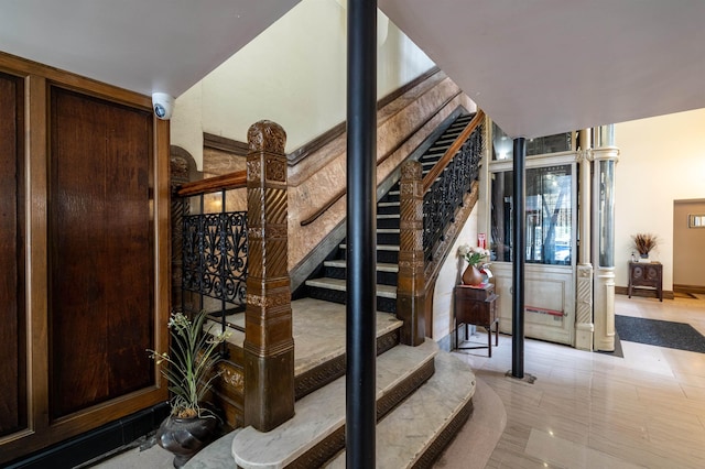 83 Montgomery St Unit 201, Jersey City, NJ 07302 - staircase featuring baseboards