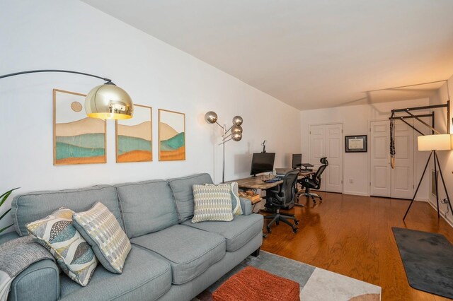4313 Smith Ave Unit 10, North Bergen, NJ 07047 - living area with wood finished floors and a desk
