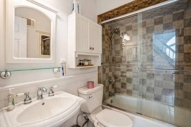 4313 Smith Ave Unit 10, North Bergen, NJ 07047 - full bathroom with a sink, combined bath / shower with glass door, and toilet