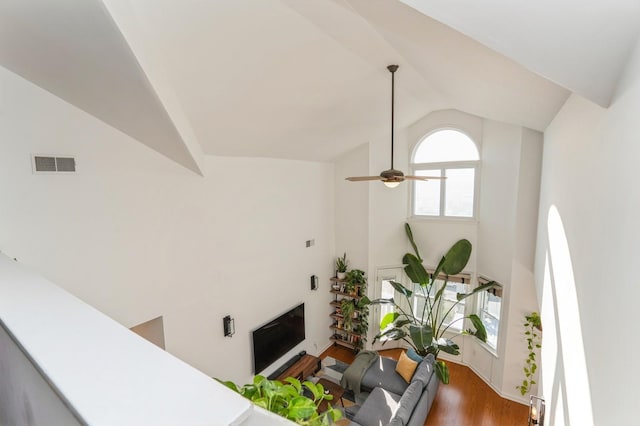 4313 Smith Ave Unit 10, North Bergen, NJ 07047 - living area featuring vaulted ceiling, wood finished floors, and ceiling fan