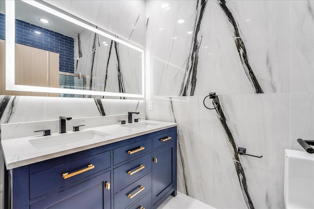 412 10th St Unit 2, Union City, NJ 07087 - bathroom featuring double vanity, a marble finish shower, and a sink