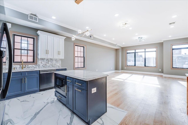 412 10th St Unit 2, Union City, NJ 07087 - kitchen featuring built in microwave, crown molding, visible vents, white cabinetry, and dishwasher