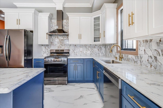 412 10th St Unit 2, Union City, NJ 07087 - kitchen with wall chimney range hood, stainless steel appliances, blue cabinetry, and crown molding