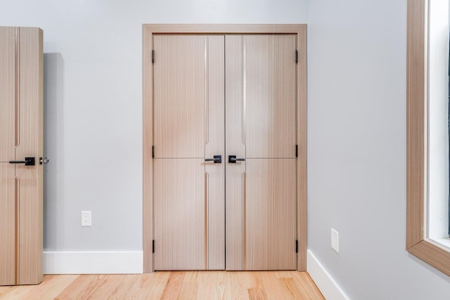 412 10th St Unit 2, Union City, NJ 07087 - unfurnished bedroom with light wood-type flooring, baseboards, and a closet