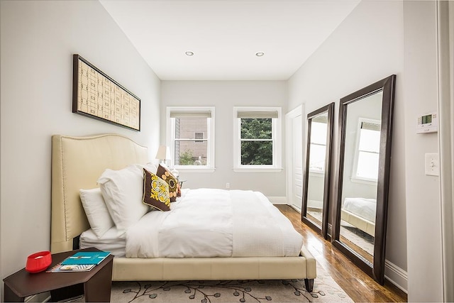 bedroom with hardwood / wood-style floors