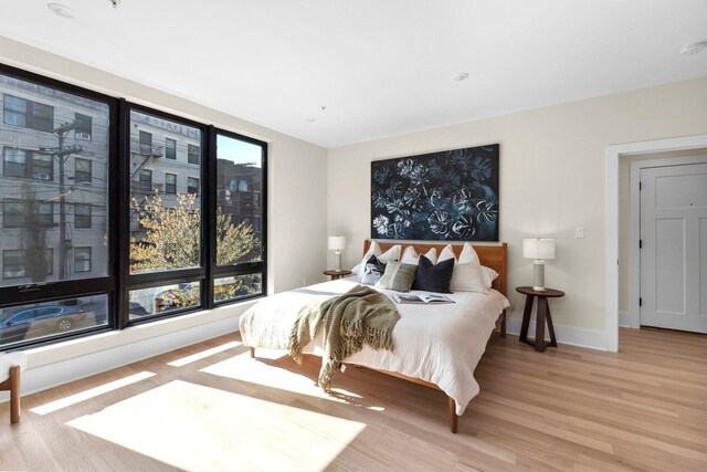 249 Bergen Ave Unit 201, Jersey City, NJ 07304 - bedroom with wood finished floors and baseboards