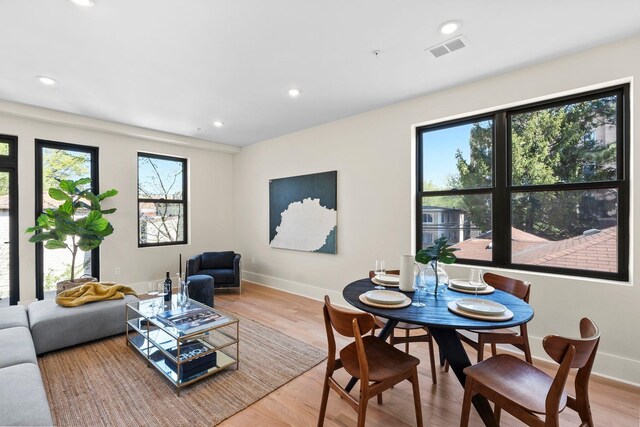 249 Bergen Ave Unit 201, Jersey City, NJ 07304 - dining space featuring healthy amount of natural light, baseboards, wood finished floors, and recessed lighting