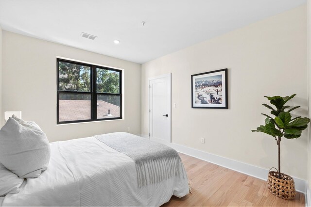 249 Bergen Ave Unit 201, Jersey City, NJ 07304 - bedroom featuring light wood-style floors, baseboards, and recessed lighting