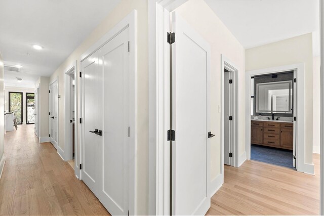 249 Bergen Ave Unit 201, Jersey City, NJ 07304 - hallway featuring light wood finished floors, baseboards, and recessed lighting
