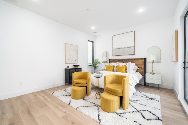 bedroom featuring recessed lighting, baseboards, and wood finished floors